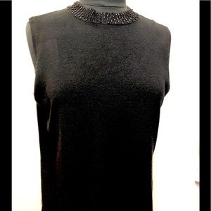 Macys sleeveless top with beads accent around the neck collar. Size Large.
